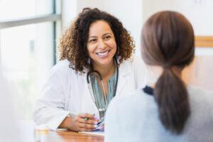 Doctor listening to her patient