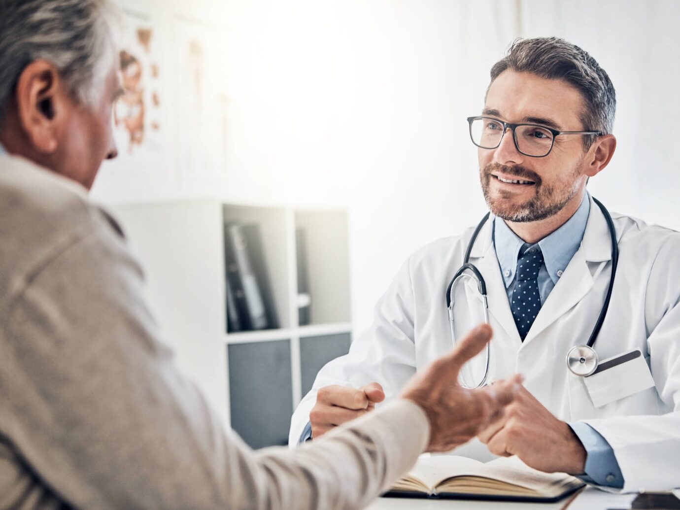 nephrologist listening to his kidney or liver transplant patient