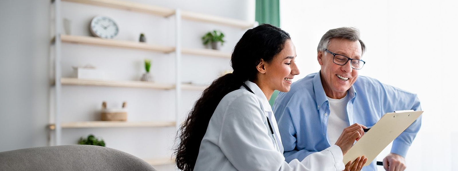 happy doctor and patient discussion of organ rejection test results