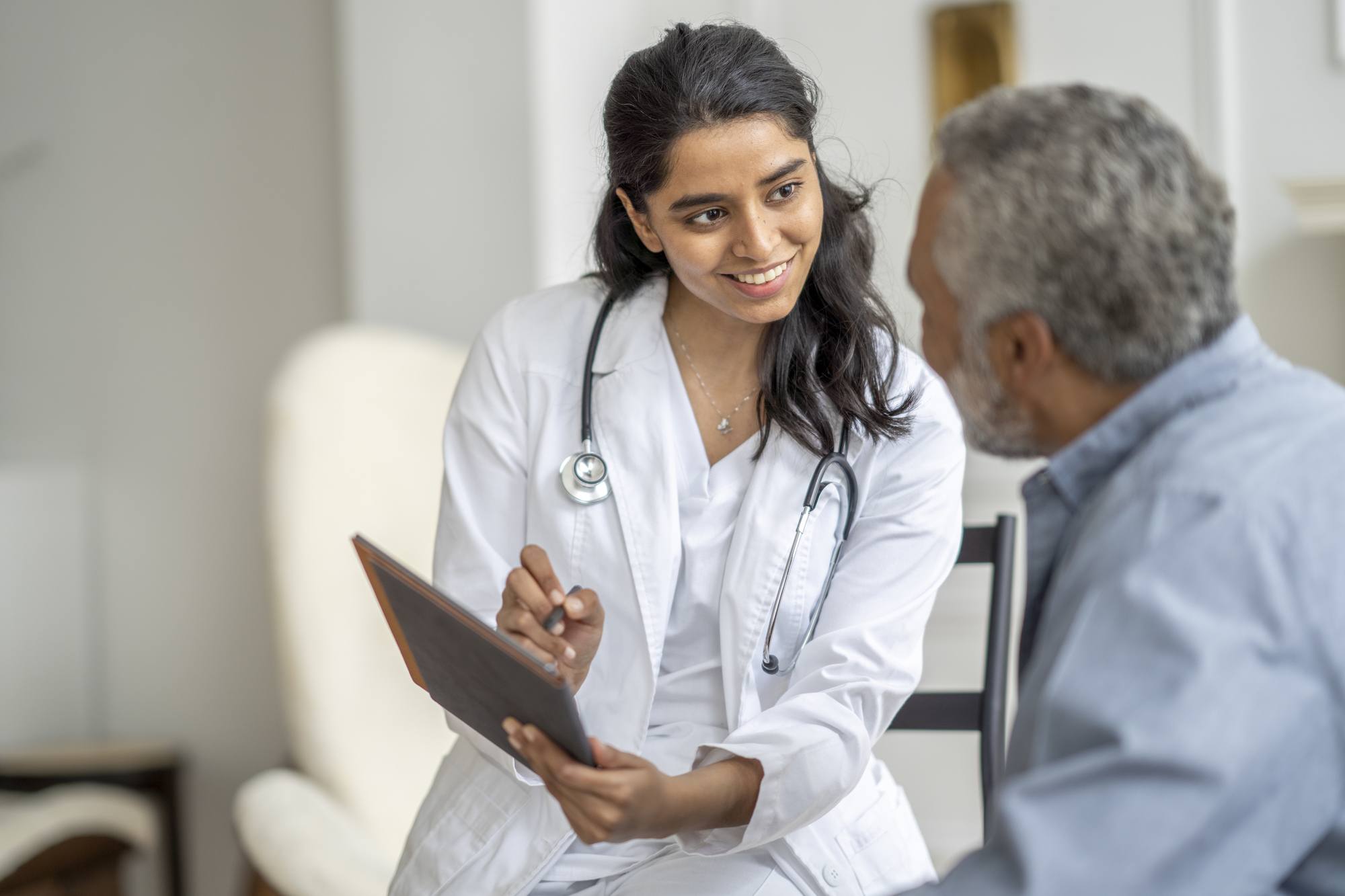 doctor performs homecare Visit with a Senior Gentleman